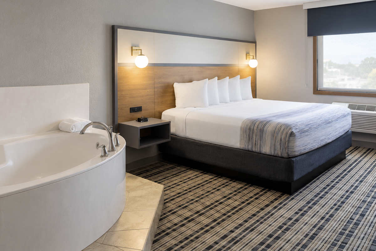 Modern King Bed Jetted Tub Suite at AmericInn in Alexandria, Minnesota