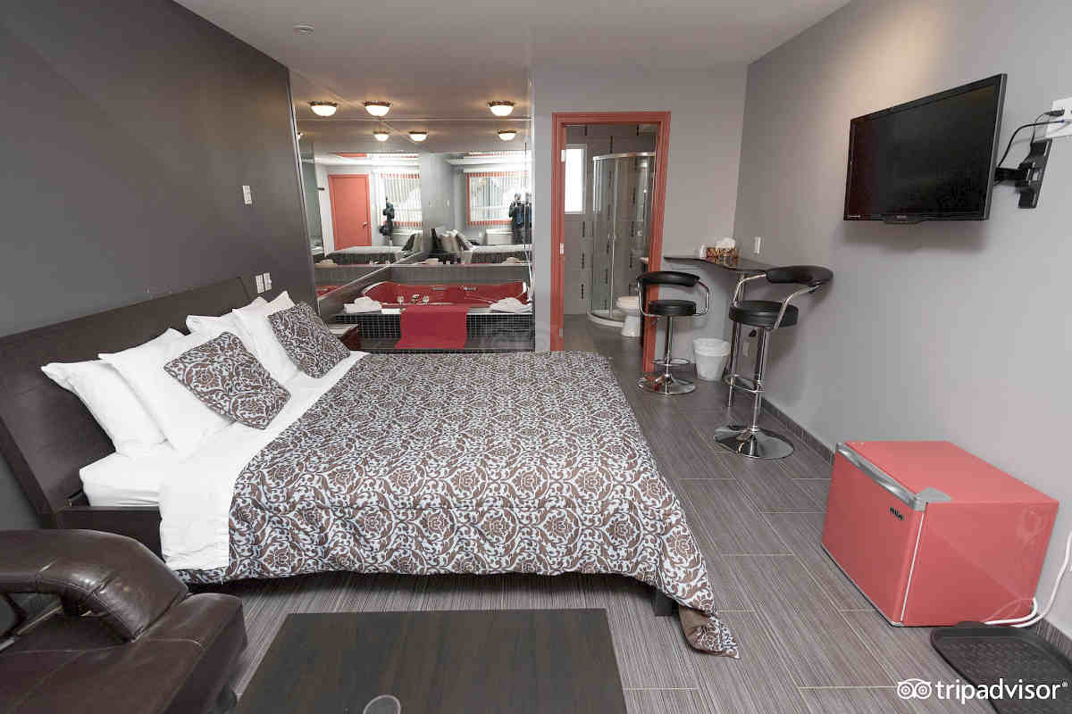 A Budget but Still Romantic Room with a Queen Bed at the Auberge St. Jacques Hotel in Montreal.