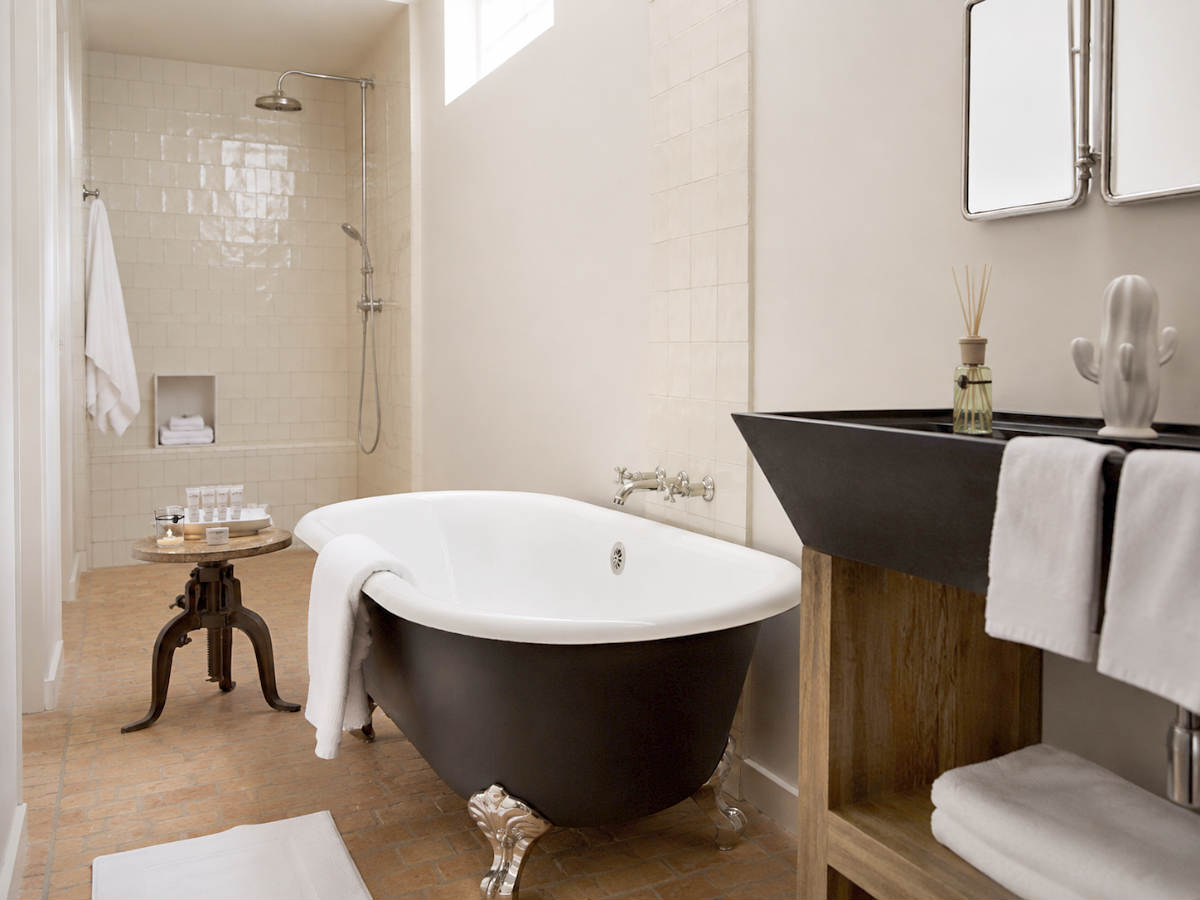 Scottsdale's Bespoke Inn with a suite that has a soaker tub and a walk-in shower.