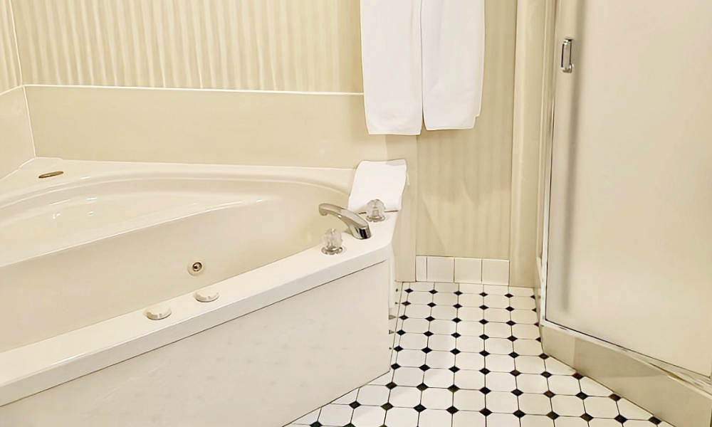 Jetted Spa Tub and Walk-In Shower at the Best Western Plus Emerald Isle Hotel in Garden City, Kansas