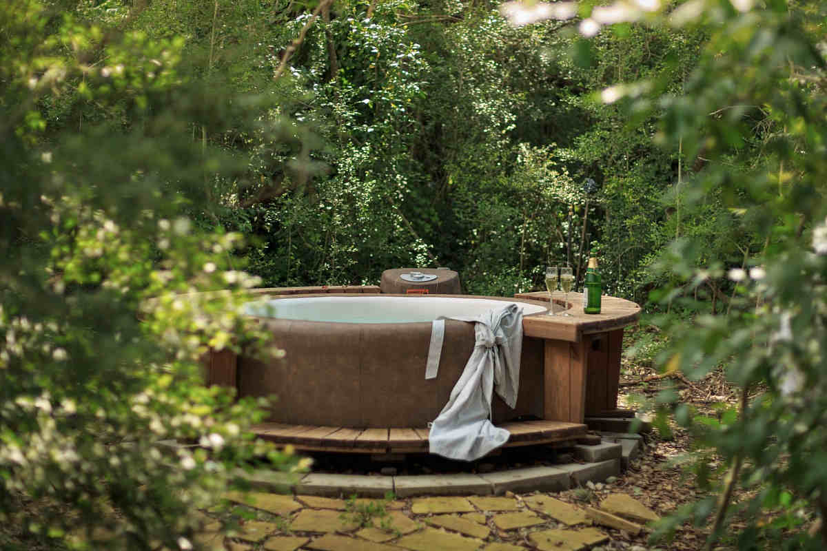 A private outdoor hot tub for 2 in a secluded spot at Blisswood Bed and Breakfast in Texas Hill Country.