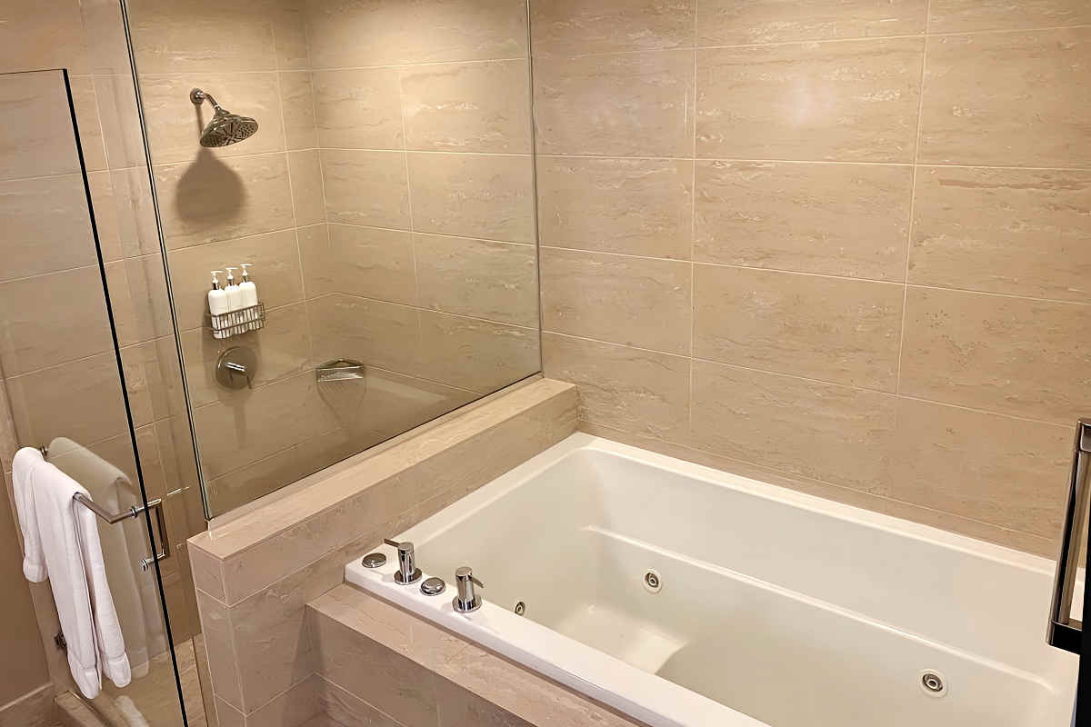 beautifyl Jetted Tub and Walk-In Shower in the Master Bath of A King Suite at the Royal Sonesta Chicago River North Hotel.
