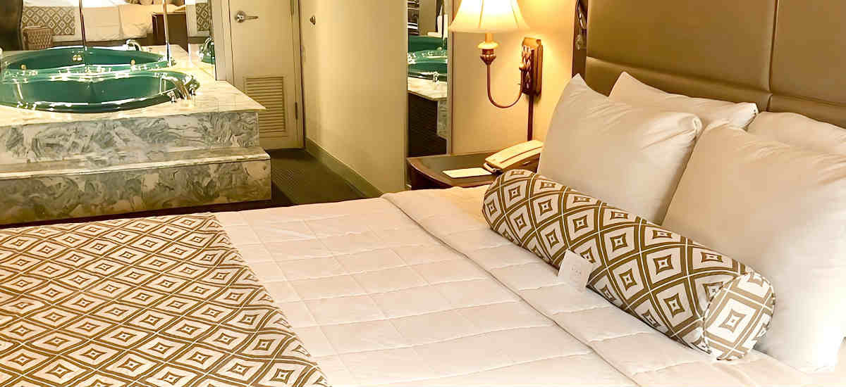King Bed with In-Room Whirlpool Tub at the Clayton Plaza Hotel, Clayton MO