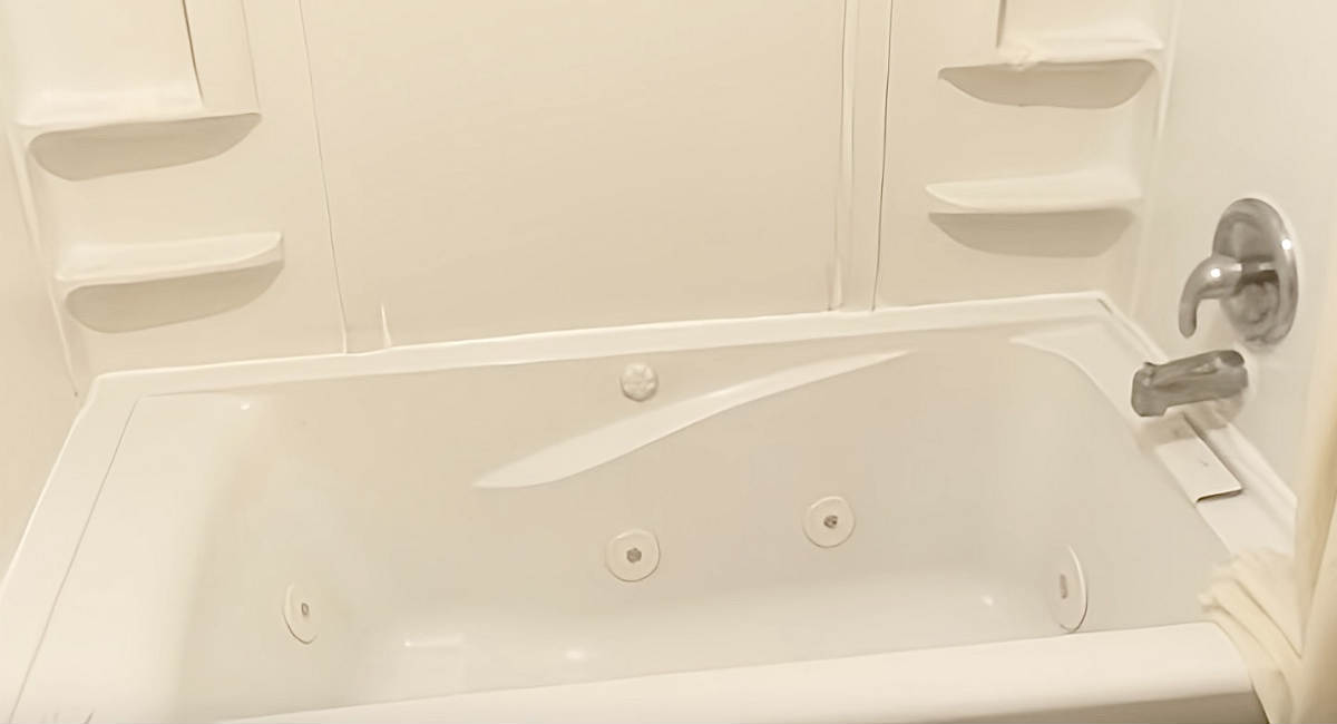 Jetted Spa Tub in a Suite at Coratel Plus Suites Wichita West Airport
