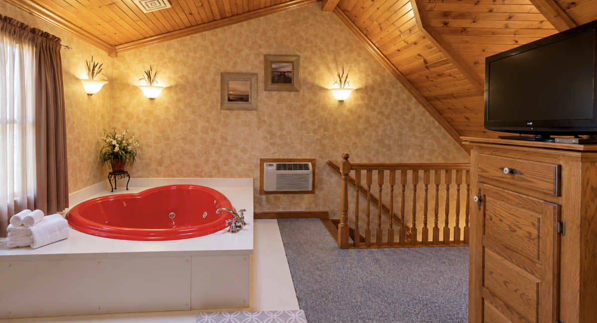 Honeymoon Suite with a Red Heart-Shaped Jetted Tub for 2 Persons at Donna's Premier Lodging in Berlin, Ohio.
