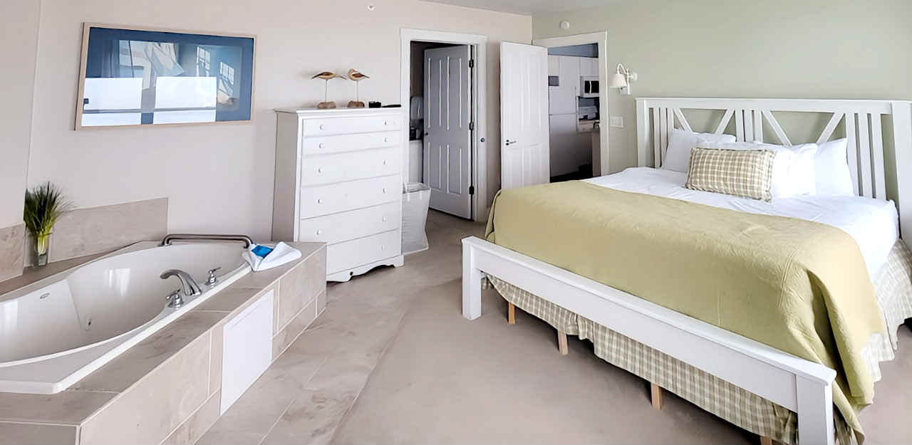 Beautiful King Bed with a Jetted Tub in a Room at the Edgewater Resort, Ephraim WI