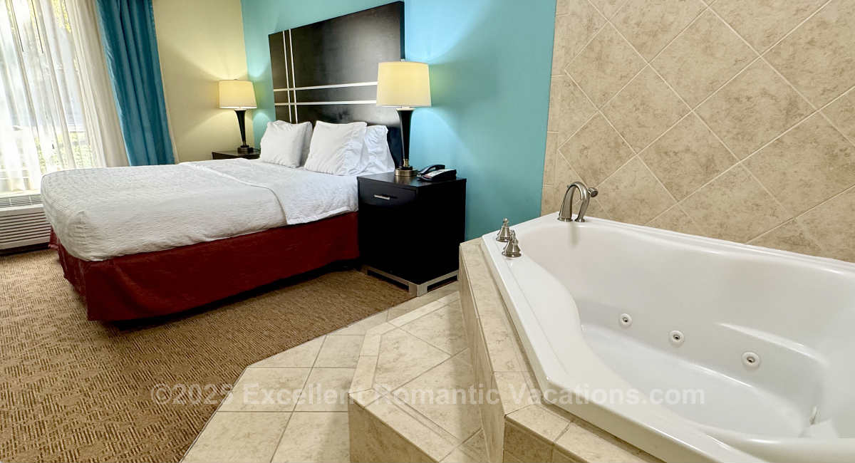 Excellent Romantic Vacations Exclusive Photo of an In-Room Whirlpool Tub and King Bed in a Suite at Hampton Inn & Suites, Austin TX