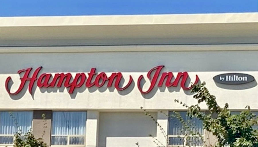 Sign at the Top of the Hampton Inn & Suites