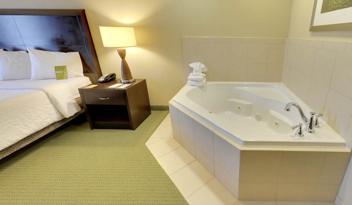 Attractive In-Room Jetted Spa Tub and King Bed at the Hilton Garden Inn Atlanta Downtown Hotel.