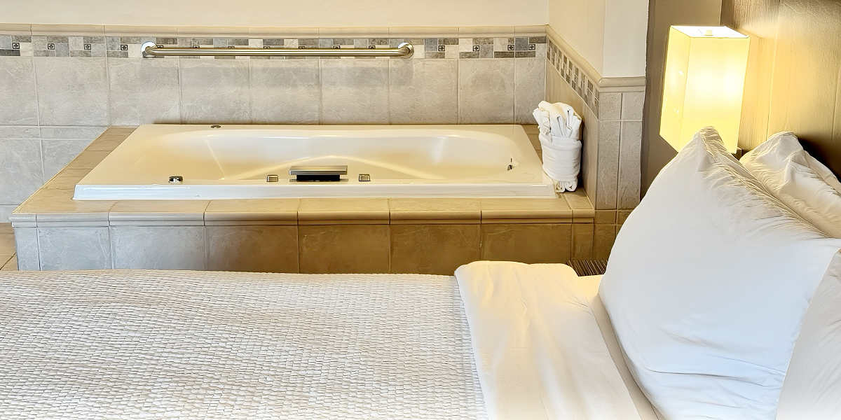 King Bed and Jetted Hot Tub at Holiday Inn College Station - Aggieland, College Station, Texas King Bed and Jetted Hot Tub at Holiday Inn College Station - Aggieland, College Station, Texas