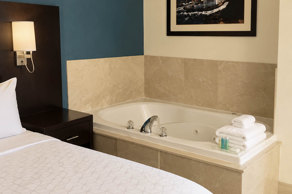 Jetted Tub and King Bed in a Suite at the Holiday Inn Express in Mackinaw City, Michigan