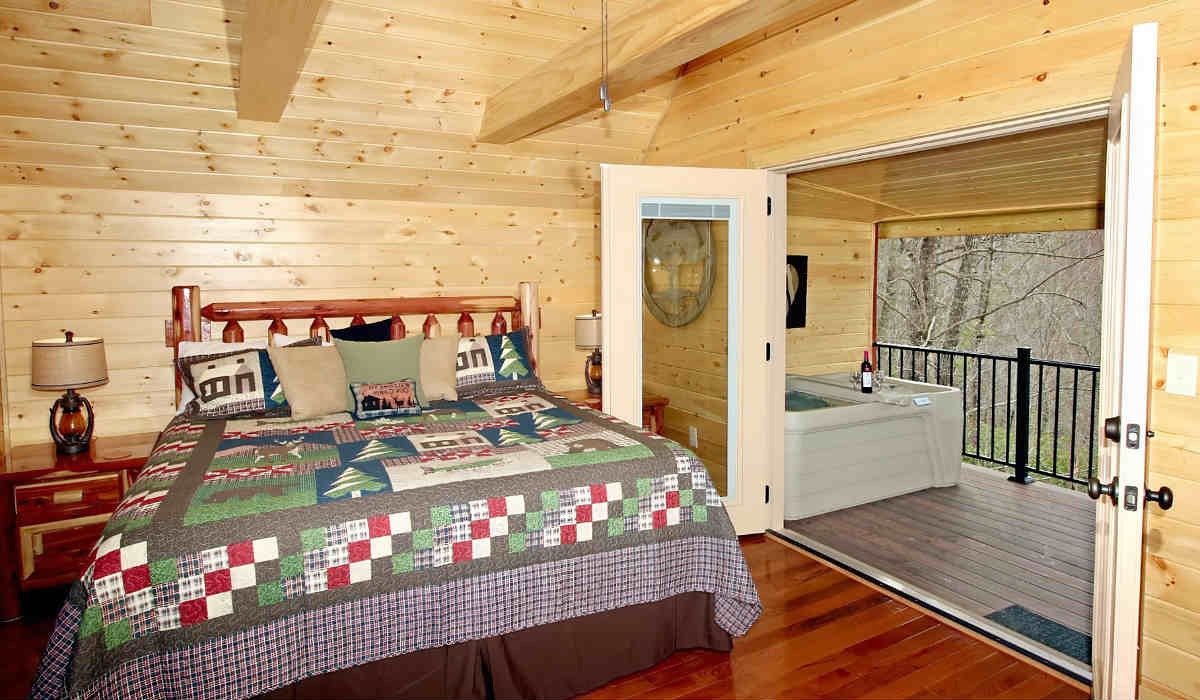 Romantic Log Cabin with a King Bed and a Private Outdoor Deck with a Hot Tub for 2 at the Honeymoon Hills Cabin Rentals in Gatlinburg, TN.