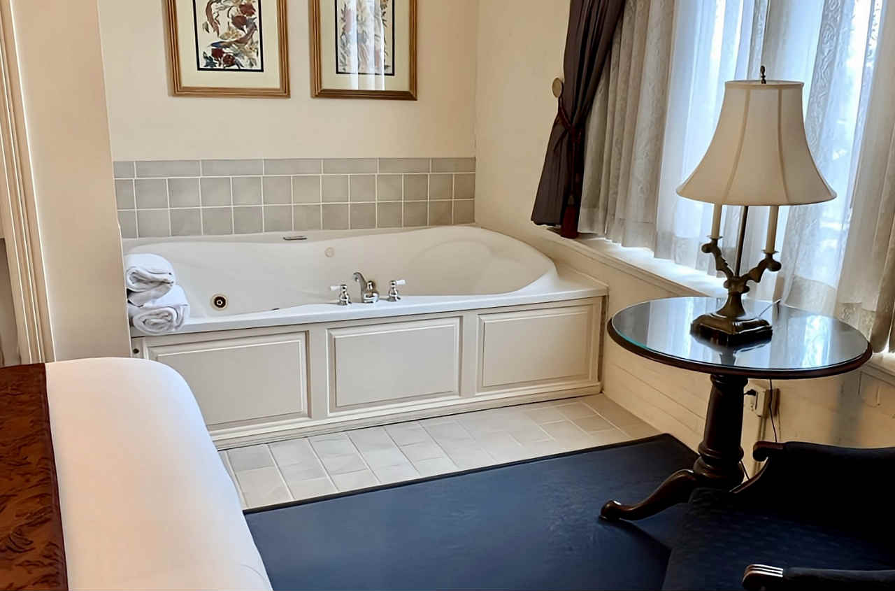 Beautiful King Suite with an In-Room Whirlpool Tub at the Hotel at Old Town in Wichita, Kansas.