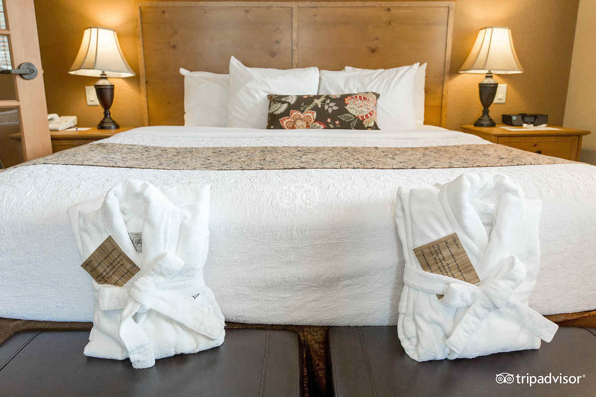 King Bed with His n' Her Robes in a Honeymoon Suite at Icicle Village Resort, Leavenworth WA