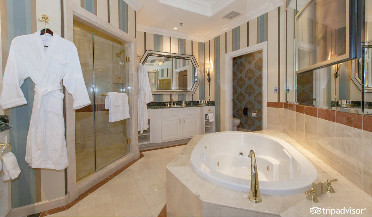 Luxurious Marble Bathroom with a Jetted Tub and Robes at the Venetian Resort in Las Vegas, Nevada.