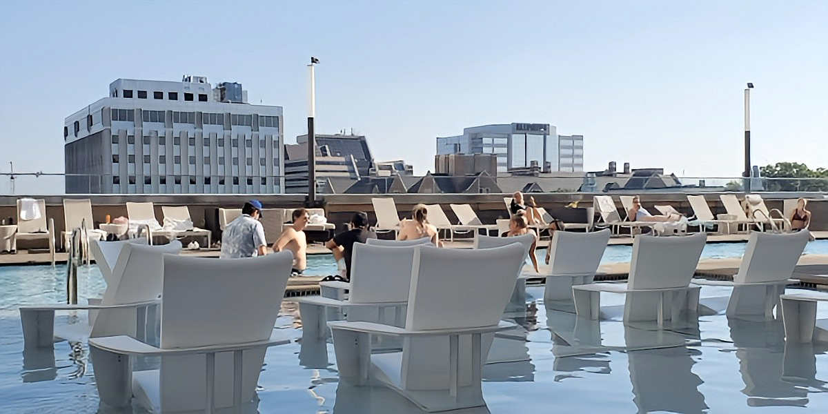 People Enjoying the Rooftop Pool at the Kimpton Aertson Hotel in Nashville