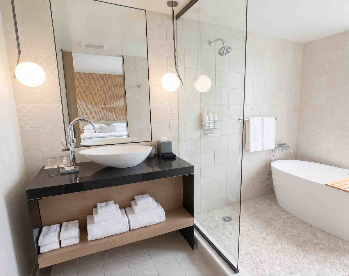 Spa-style Bathroom with Soaker Tub and Walk-in Shower for 2 in a Suite at Kimpton La Peer Hotel in West Hollywood