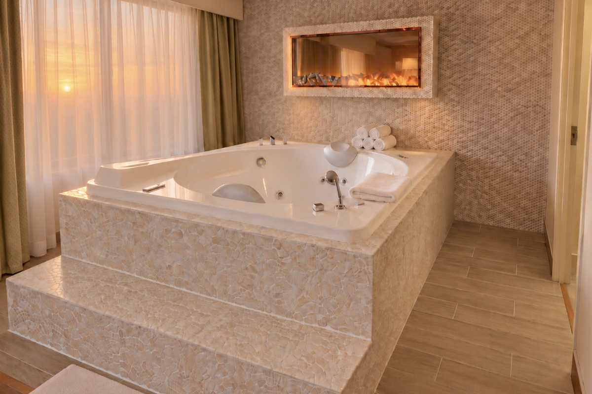 Step-up Jetted Tub & Fireplace in a Suite at the Leo Collection Hotel, Detroit MI