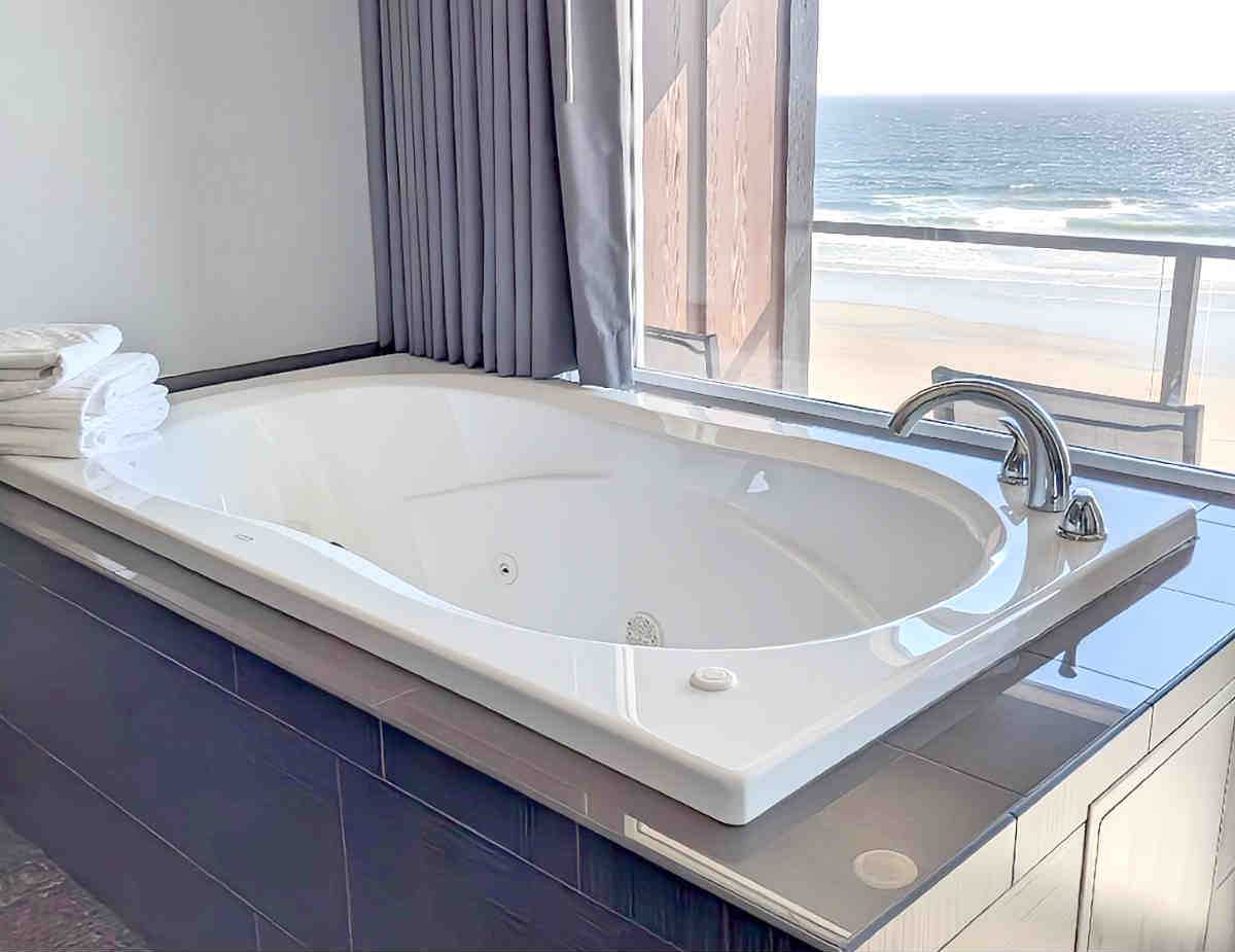 Jetted Spa Tub with an Ocean View at the Starfish Manor Oceanfront Hotel