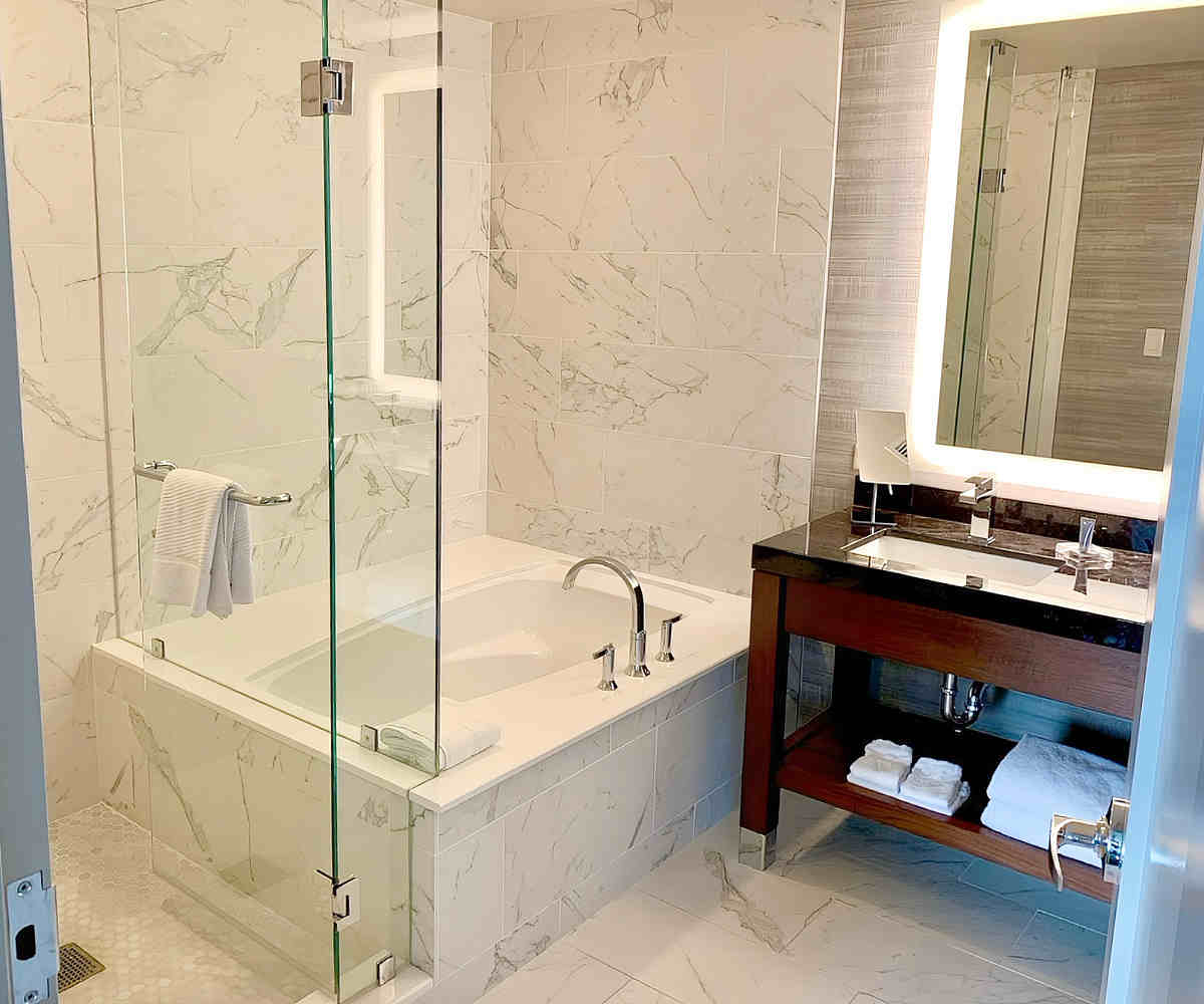 Master Bathroom with Deep Soaker Tub and Walk-In Shower at the Marriott Marquis in Houston, Texas.