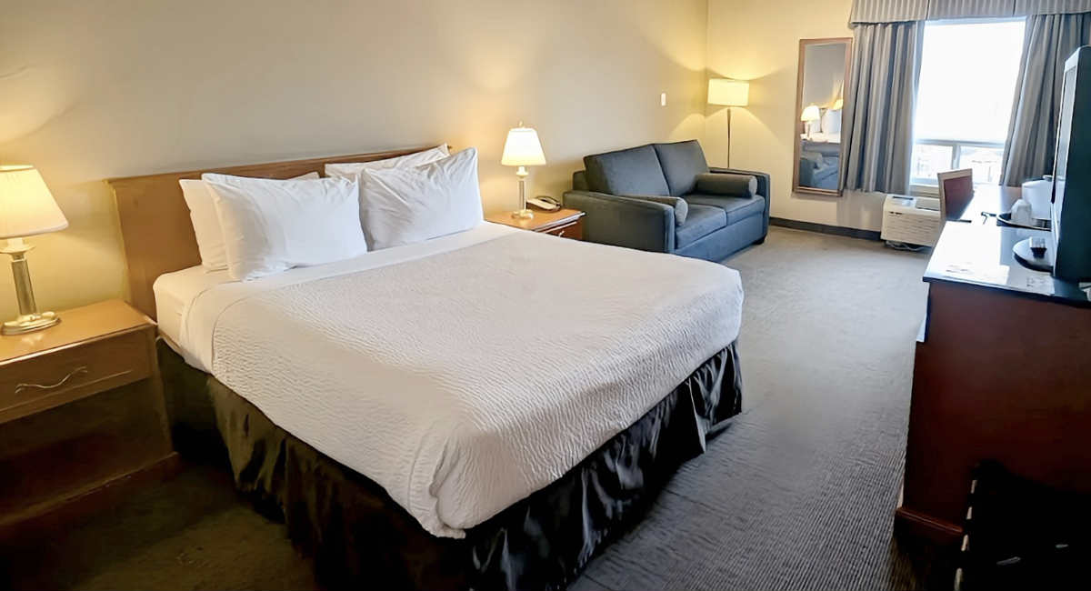 King Bed Room at Nomad Hotel & Suites in Fort MacMurray, AB.