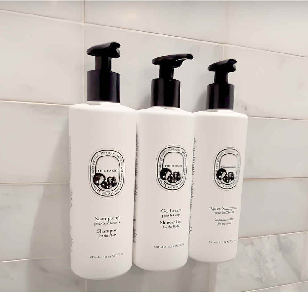 Shampoo, Conditioner and Body Gel Inside a Walk-In Shower in a Suite at Palihouse West Hollywood, CA