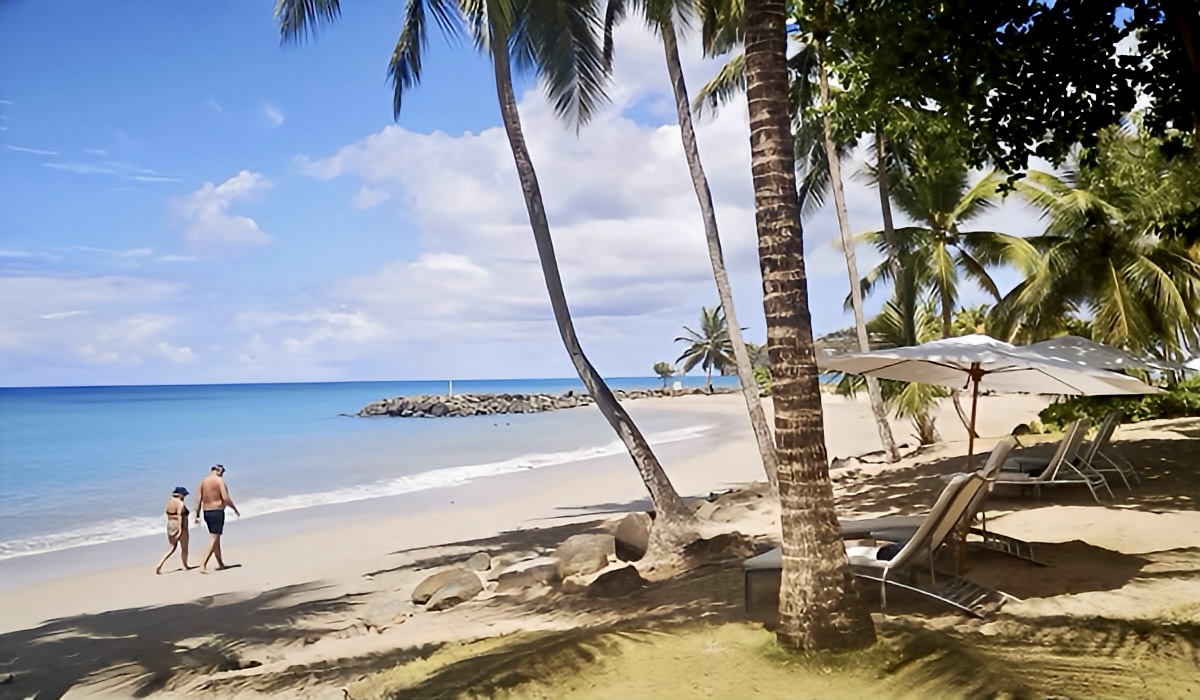 Couple Walking Along The Beach at Stolentime Resort in St. Lucia