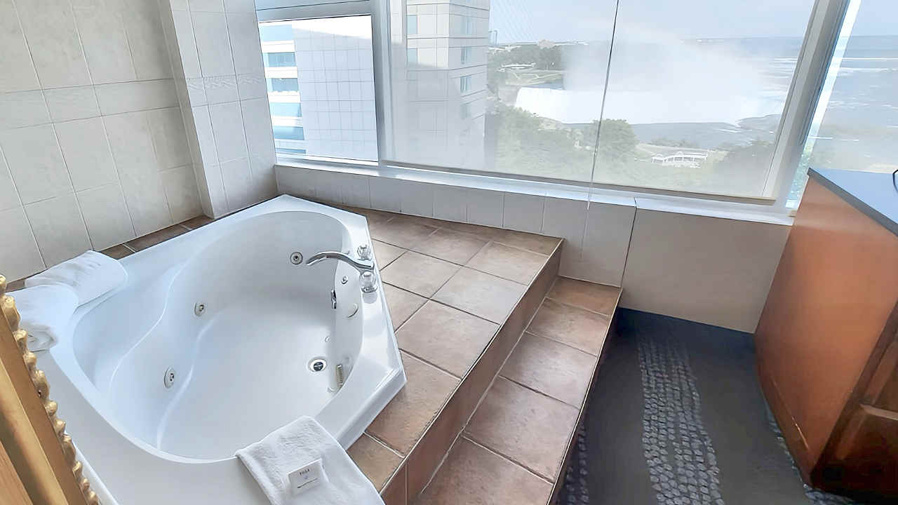A Suite at the Niagara Fallsview Hotel with a Whirlpool Tub Close to the Window with a View of the Canadian Horseshoe Falls