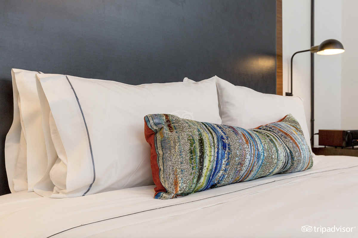 Pillows on a Bed in a Room at the Renwick Hotel, NYC