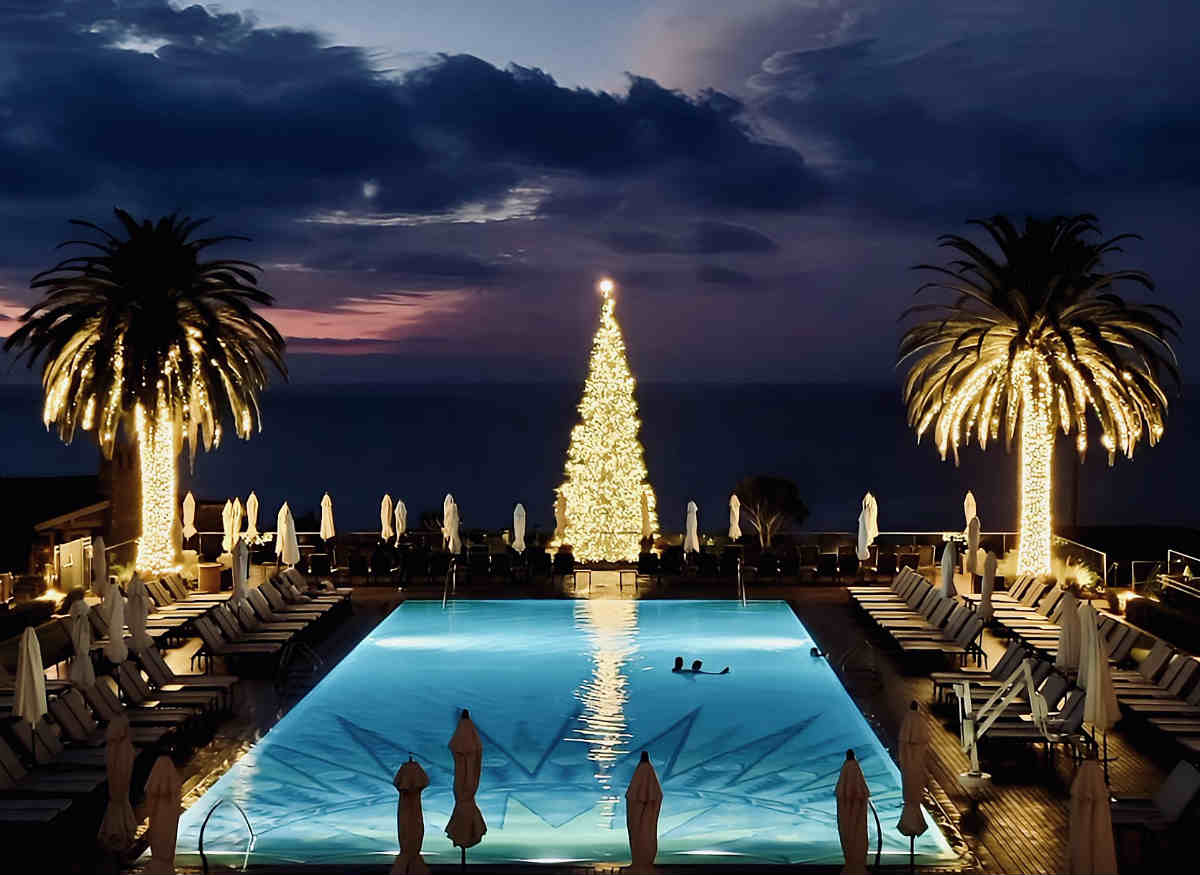 Honeymoon Couple Swimming in the Pool at Night at Montage Laguna Beach Resort in California.