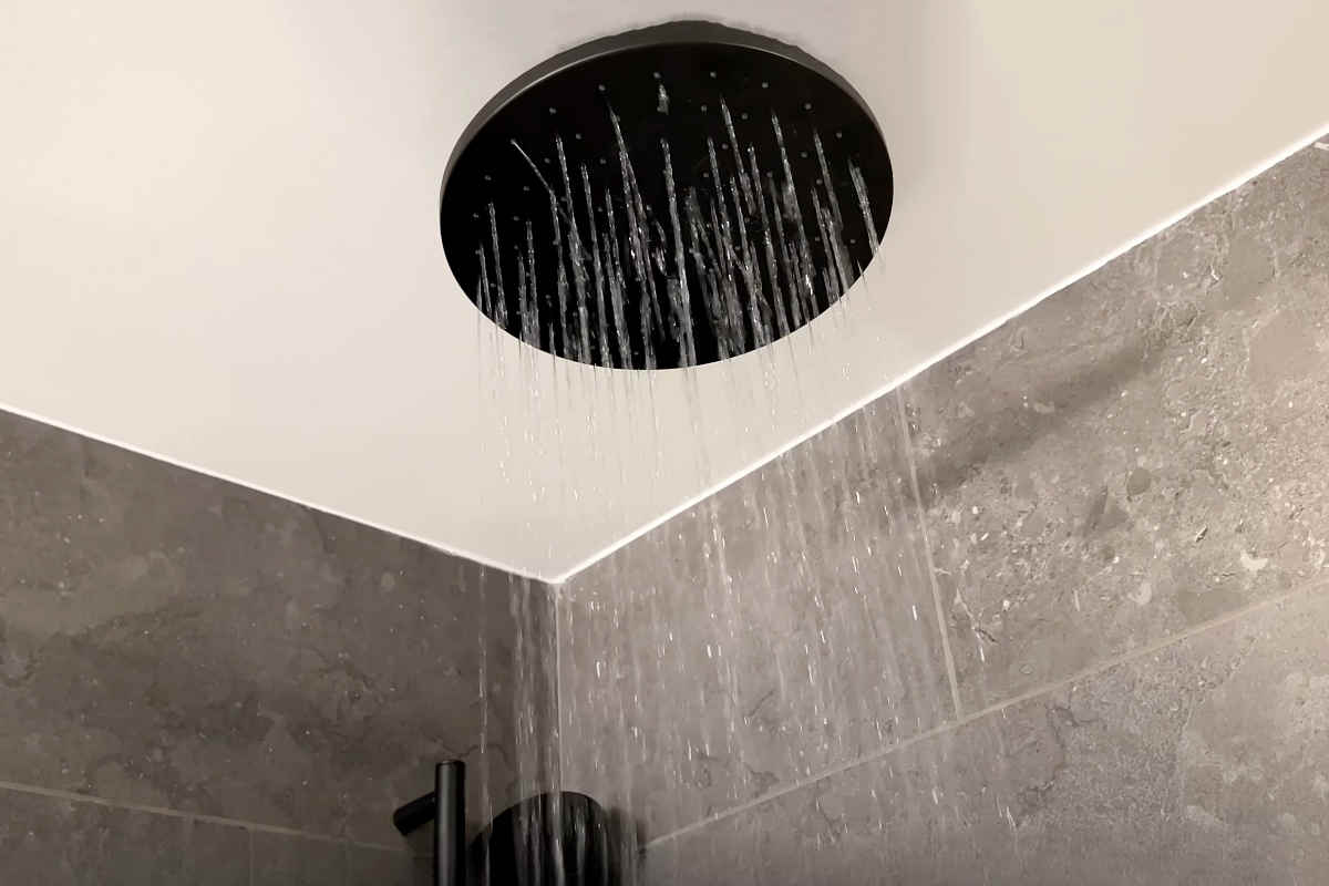 Photo of Water Coming Out of a Rain Shower Head in the Master Bath of a Suite at 1 Hotel in San Francisco