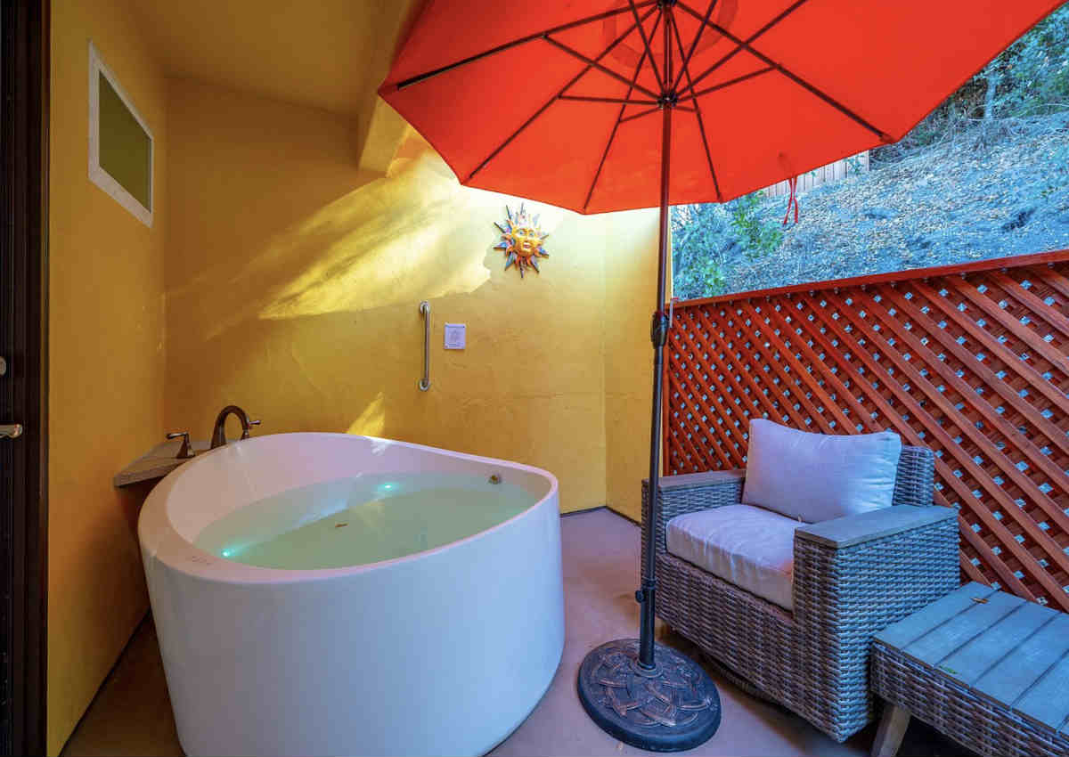 Hot Tub Big Enough for 2 on a Private Outdoor Patio in a Suite at the Sycamore Resort, San Luis Obispo, CA.