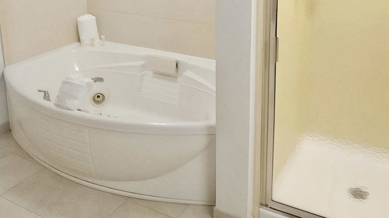 Whirlpool Tub & Walk-In Shower at the Hampton Inn & Suites Tampa-Wesley Chapel.