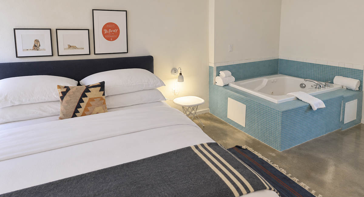 King Bed and Corner Jetted Tub in a Room at the Trumbull & Porter Hotel in Detroit
