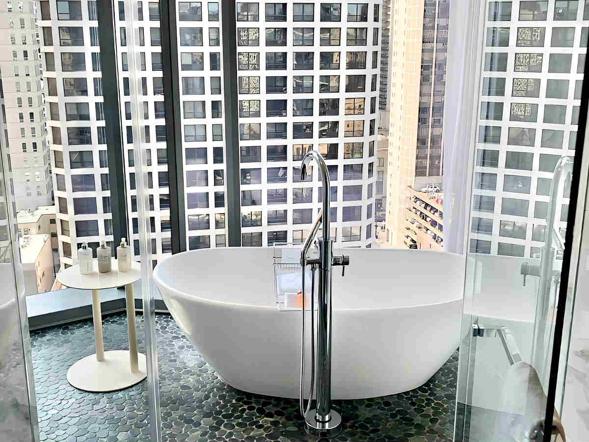 Bathroom with Deep Soaking Tub and City View at the Viceroy Hotel in Chicago