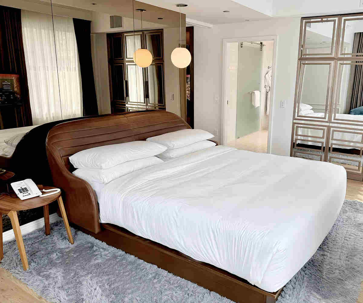 Romantic Room with a King Bed and Walk-In Shower at the Virgin Hotel Chicago.