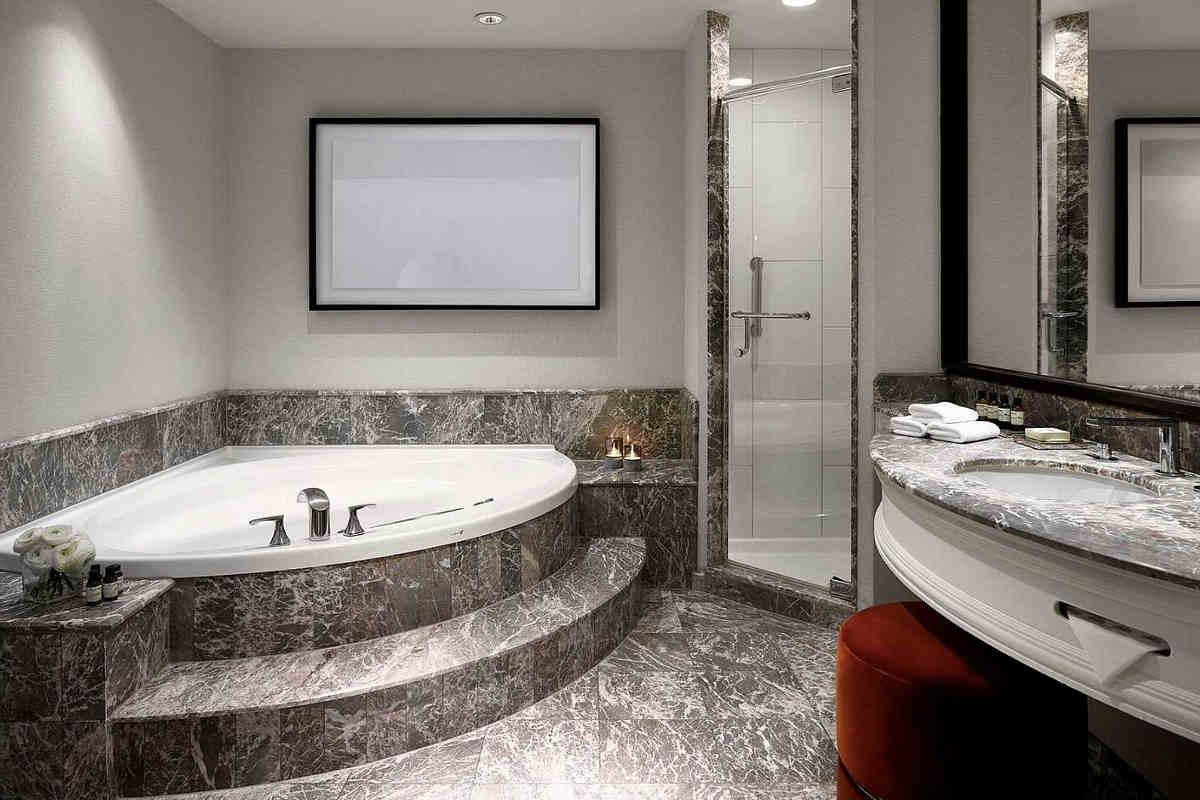 Corner Whirlpool Tub in a Suite with a Marble Bathroom at the Vogue Hotel in Downtown Montreal, QC.
