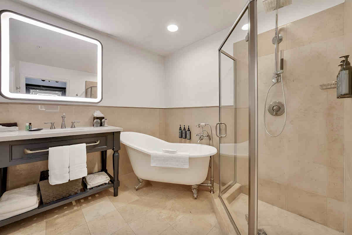 Photo of a luxurious bathroom with walk-in rain shower at the Westin Sacramento Riverfront, California.