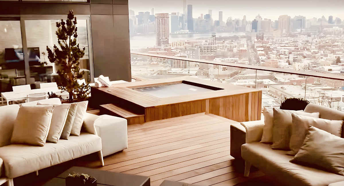 Loft Suite Featuring an Open Air Hot Tub with Views of New York City.
